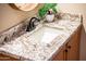 Bathroom vanity showcases granite countertops and a modern faucet at 12928 W Santa Ynez Dr, Sun City West, AZ 85375