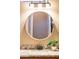 Bathroom with round mirror and granite countertop at 12928 W Santa Ynez Dr, Sun City West, AZ 85375