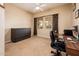 Bedroom with an open floor plan, an area rug, a desk, and a convertible cabinet at 12928 W Santa Ynez Dr, Sun City West, AZ 85375