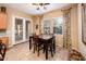 Cozy breakfast nook with table, chairs, and large windows for natural light at 12928 W Santa Ynez Dr, Sun City West, AZ 85375