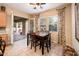 Bright breakfast nook with a dining table, chairs, and a sliding door to patio at 12928 W Santa Ynez Dr, Sun City West, AZ 85375