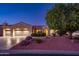 Inviting single-story home boasting a well-manicured front yard, mature tree, and a three-car garage at 12928 W Santa Ynez Dr, Sun City West, AZ 85375