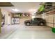 A well-organized garage featuring ample storage with racks and cabinets at 12928 W Santa Ynez Dr, Sun City West, AZ 85375