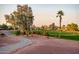 Scenic view of golf course, palm trees, and lush greenery at 12928 W Santa Ynez Dr, Sun City West, AZ 85375