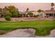 Scenic view of the golf course and desert landscaping behind the home at 12928 W Santa Ynez Dr, Sun City West, AZ 85375
