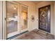 Outdoor patio view through sliding glass doors, looking towards an ornate security door at 12928 W Santa Ynez Dr, Sun City West, AZ 85375