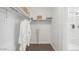 Bright bathroom featuring a shower, built in shelves and rods for storage at 1324 S Mullberry St, Florence, AZ 85132