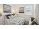 Comfortable bedroom with a patterned bedspread, accent pillows, and lots of natural light at 1324 S Mullberry St, Florence, AZ 85132
