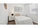 Charming bedroom with a white bed, side tables, and natural light from the window at 1324 S Mullberry St, Florence, AZ 85132