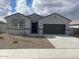 Charming single-story home with a well-maintained front yard and a two-car garage at 1324 S Mullberry St, Florence, AZ 85132