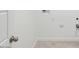Clean and well-lit laundry room with white walls and tile flooring at 1324 S Mullberry St, Florence, AZ 85132
