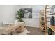 Bright home office featuring a modern desk, decorative shelving unit, and neutral decor at 1324 S Mullberry St, Florence, AZ 85132