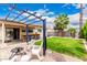 Private backyard with a firepit, outdoor bar, beautiful plants and landscaping plus relaxing ambiance at 13359 W Post Dr, Surprise, AZ 85374