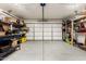 Spacious two car garage with overhead lights and built in shelving units perfect for storage at 13359 W Post Dr, Surprise, AZ 85374