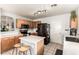 Functional kitchen with stainless steel appliances, tile flooring and ample natural light at 13359 W Post Dr, Surprise, AZ 85374