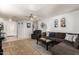 Inviting living room with plush seating, neutral tones, and ample space for relaxation and entertainment at 13359 W Post Dr, Surprise, AZ 85374