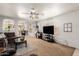 Bright living room showcasing a large sectional sofa, neutral walls, and an open concept design at 13359 W Post Dr, Surprise, AZ 85374