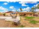 Poolside patio with outdoor seating in a spacious backyard setting at 134 E Le Marche Ave, Phoenix, AZ 85022