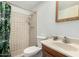 A full bathroom with standard fixtures, including a shower, toilet, and single sink vanity at 134 E Le Marche Ave, Phoenix, AZ 85022