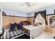 Charming bedroom with blue walls, bamboo accents, and a view of the outside at 134 E Le Marche Ave, Phoenix, AZ 85022