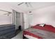 Comfortable bedroom featuring a full-size bed, dresser with mirror, and a spacious closet for storage at 134 E Le Marche Ave, Phoenix, AZ 85022