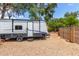 A travel trailer with a Springdale Recreational Vehicles logo, parked outdoors with gravel ground at 134 E Le Marche Ave, Phoenix, AZ 85022