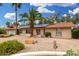 Charming single-story home with desert landscaping, solar panels and a brick facade at 134 E Le Marche Ave, Phoenix, AZ 85022