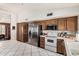 Bright kitchen featuring stainless steel appliances, white countertops and ample cabinet space at 134 E Le Marche Ave, Phoenix, AZ 85022
