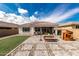 Spacious backyard showcases beautiful pavers, a picnic table, and playhouse at 14549 W Corrine Dr, Surprise, AZ 85379