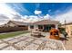 Backyard features pavers, a picnic table, and playhouse at 14549 W Corrine Dr, Surprise, AZ 85379