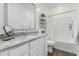 Well-lit bathroom boasts granite countertops and shower-tub combination at 14549 W Corrine Dr, Surprise, AZ 85379