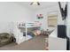 Cozy bedroom features a bunk bed, window and comfortable seating at 14549 W Corrine Dr, Surprise, AZ 85379