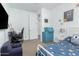 Inviting bedroom with desk, gaming chair, and cozy blue bed at 14549 W Corrine Dr, Surprise, AZ 85379
