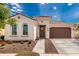 Charming single-story home with a well-manicured front yard and a cozy, inviting entryway at 14549 W Corrine Dr, Surprise, AZ 85379