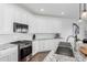 Well-equipped kitchen with modern appliances, granite countertops, and a view of the backyard at 14549 W Corrine Dr, Surprise, AZ 85379