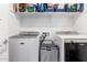 Efficient laundry room with modern washer and dryer appliances at 14549 W Corrine Dr, Surprise, AZ 85379