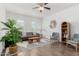 Bright living room with stylish decor, wood floors, and a large area rug at 14549 W Corrine Dr, Surprise, AZ 85379