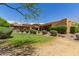 Expansive backyard with green lawn and mature landscaping at 14619 E Desert Vista Trl, Scottsdale, AZ 85262