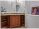 Bathroom featuring a granite vanity, a large mirror, and cubby shelves for additional storage at 14619 E Desert Vista Trl, Scottsdale, AZ 85262