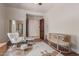 Bedroom featuring wood floors, ceiling fan, and a rocking chair at 14619 E Desert Vista Trl, Scottsdale, AZ 85262