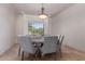 Dining room with view, chandelier and comfortable chairs at 14619 E Desert Vista Trl, Scottsdale, AZ 85262