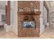 Living room featuring a stone fireplace and mantel, as well as a marble floor at 14619 E Desert Vista Trl, Scottsdale, AZ 85262