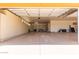 Spacious garage with epoxy flooring, built-in cabinets and shelving for ample storage at 14619 E Desert Vista Trl, Scottsdale, AZ 85262