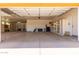 Spacious three-car garage with ample storage shelves along the back wall at 14619 E Desert Vista Trl, Scottsdale, AZ 85262