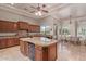 Bright kitchen with custom cabinets, an island, granite countertops, a breakfast area, and stainless steel appliances at 14619 E Desert Vista Trl, Scottsdale, AZ 85262