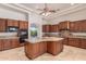Spacious kitchen features an island, granite countertops, and custom cabinets at 14619 E Desert Vista Trl, Scottsdale, AZ 85262