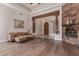 Hardwood floors and stone fireplace in this comfortable living room at 14619 E Desert Vista Trl, Scottsdale, AZ 85262