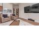 Well-decorated living room with hardwood flooring, plush seating, and a flat-screen TV at 14619 E Desert Vista Trl, Scottsdale, AZ 85262