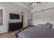 Large primary bedroom with wood floors, sitting area, media center and ensuite bath at 14619 E Desert Vista Trl, Scottsdale, AZ 85262