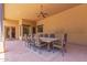 Covered patio with a dining table set, complete with ceiling fan at 14619 E Desert Vista Trl, Scottsdale, AZ 85262